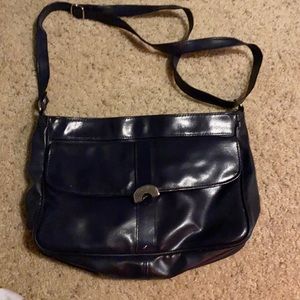 Faux leather navy blue purse front pocket zipper enclosure adjustable strap